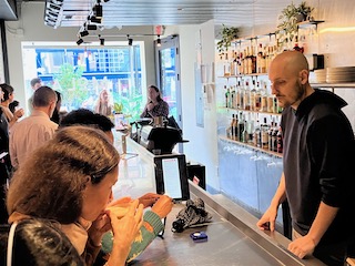 Customer paying with Split at the bar